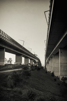 The Gateway Bridge (Sir Leo Hielscher Bridges) at sunset in Brisbane, Queensland, Australia. Abstract black and white image.