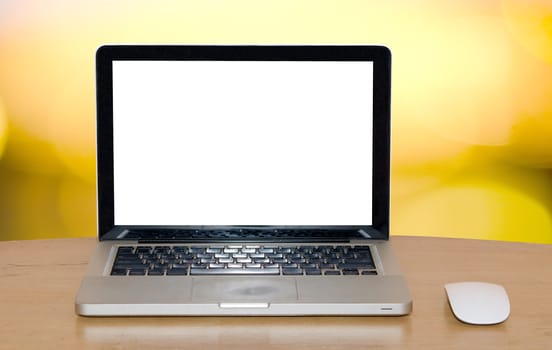 Laptop computer with blank white screen.gold background.