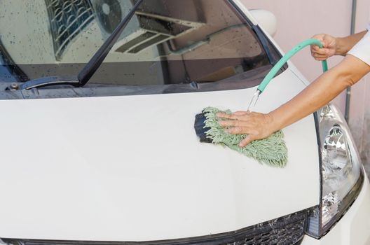 Washing a car with water