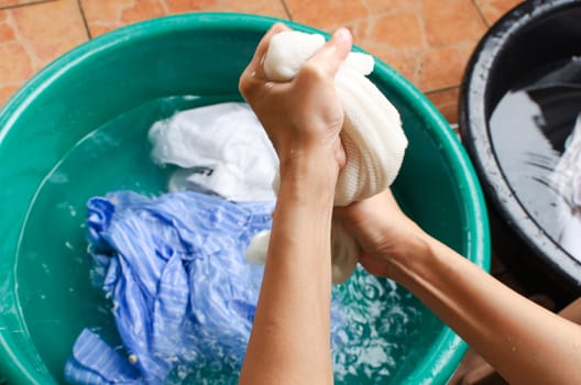 Women washing clothes,the Washing plastic basins.