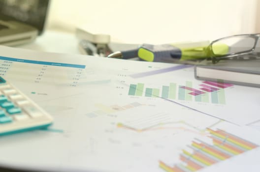 Graphs and charts, business table. The workplace of business people.