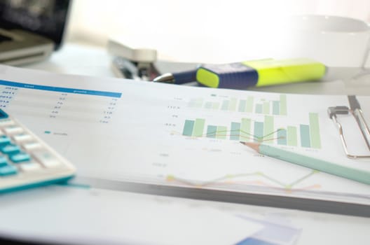 Graphs and charts, business table. The workplace of business people.