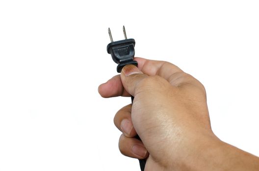 Power plug in a hand on a white background