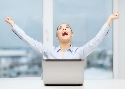 business, technology and office concept - screaming businesswoman with laptop in office