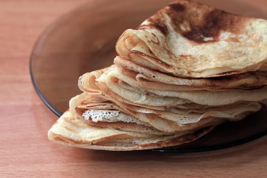 Close up of a pancakes pile with copy-space on the top