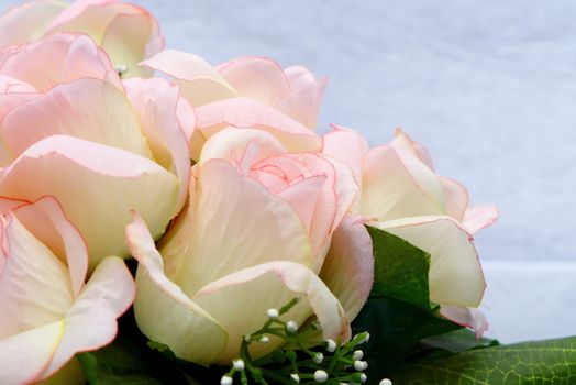 Pink artificia flower on white cloth background