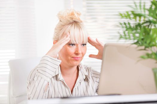 Beautiful mature Business woman having problems at work