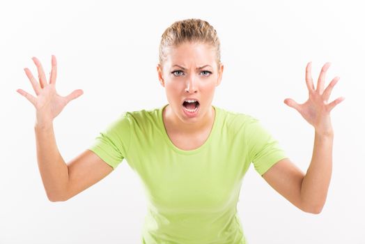 Portrait of a shocked yelling young woman with open arms.
