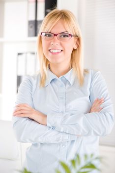 Beautiful Businesswoman with glasses standing in the office.