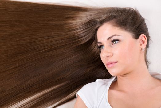 Portrait of Cute young girl with Beautiful healthy shiny hair.