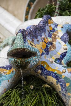 Barcelona, Spain - September 21, 2015: Multicoloured mosaic dragon, Park Guell
