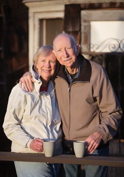 Happy European senior couple together standing outdoors