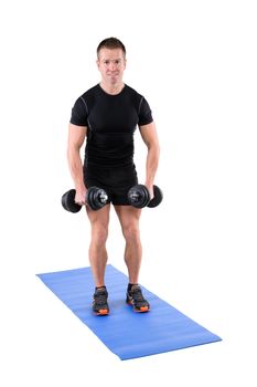 young man fitness instructor shows starting position of standing dumbbell lateral raise, isolated on white