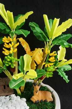 Amazing banana tree make from clay to decor for house, handmade product with green banana leaf, bunch of banana make art, wonderful mini scene