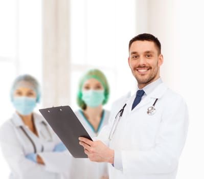 medicine, profession, and healthcare concept - smiling male doctor with clipboard and stethoscope writing prescription over white background