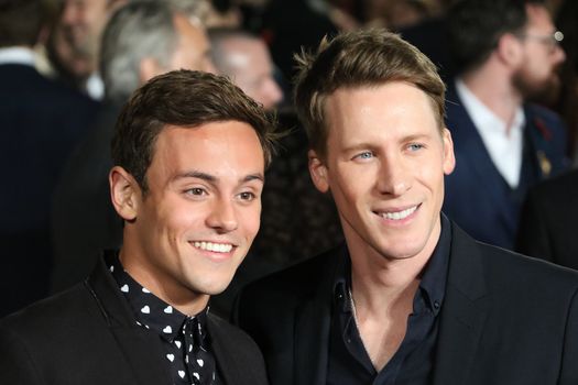 UNITED KINGDOM, London: Tom Daley (left) and Dustin Lance Black attend the UK premiere of The Hunger Games: Mockingjay - Part 2 at Odeon Leicester Square in London on November 5, 2015. 