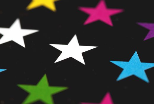 Photo of colored stars on a black background