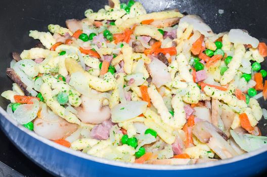 Noodles in the pan, Käsespätzle Austrian specialty.
