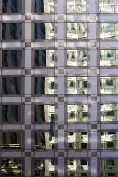 The facade of a modern apartment building with reflection
