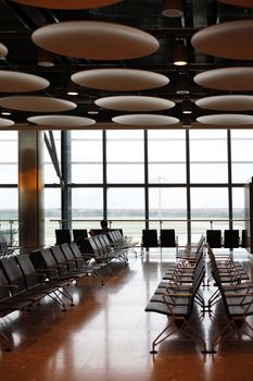 Chairs in a row at airport waiting room