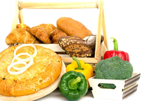 Composition with bread and vegetable in basket isolated on white .