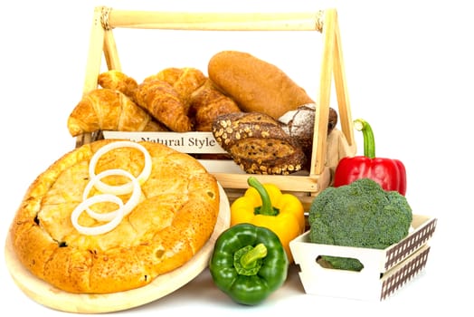 Composition with bread and vegetable in basket isolated on white .