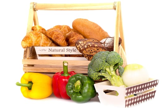 Composition with bread and vegetable in basket isolated on white .