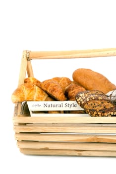 Composition with bread in basket isolated on white .