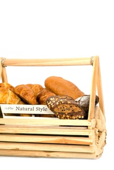 Composition with bread in basket isolated on white .