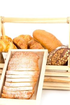 Composition with bread in basket isolated on white .