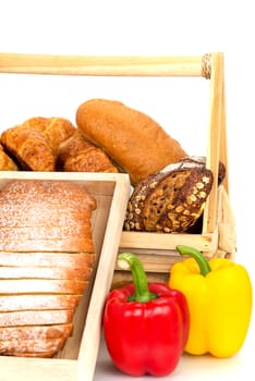 Composition with bread and vegetable in basket isolated on white .