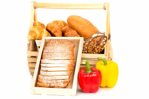 Composition with bread and vegetable in basket isolated on white .