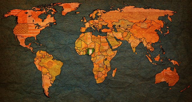 nigeria flag on old vintage world map with national borders