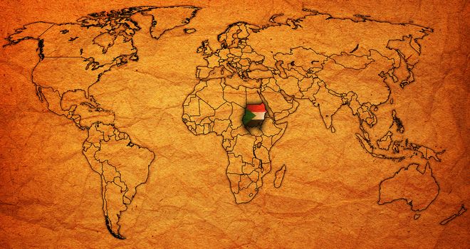 sudan flag on old vintage world map with national borders