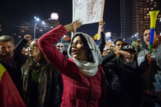 ROMANIA, Bucharest: Tens of thousands people demonstrated in the streets of Bucharest, Romania on November 5, 2015 to show their discontent with political corruption in the country. On Wednesday, Victor Ponta, Romania's prime minister, resigned after more than 30,000 people demanded he step down over the terrible Colectiv nightclub fire that left 32 people dead and more than 130 still hospitalized. Protesters marched in the center of the city blocking traffic in the area.Through taking to the streets, the civil society is trying to battle the endemic corruption in the country.