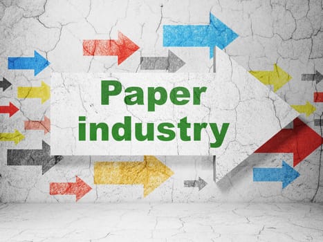 Manufacuring concept:  arrow with Paper Industry on grunge textured concrete wall background