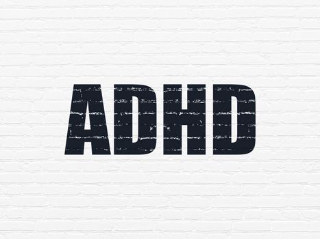 Healthcare concept: Painted black text ADHD on White Brick wall background