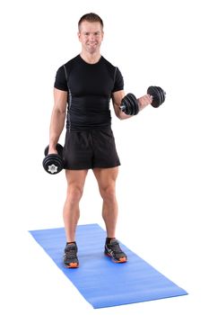 young man fitness instructor shows finishing position of standing dumbbell dumbbell biceps curl, isolated on white