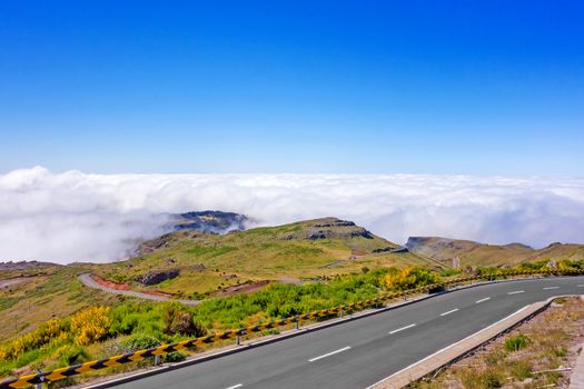In the heart of Madeira near mountain Pico Ruivo - view over the cloud ceiling, blue sky