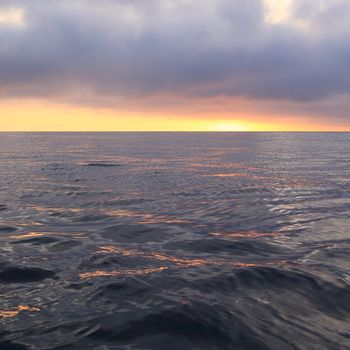 Sunrise on the ocean from the boat