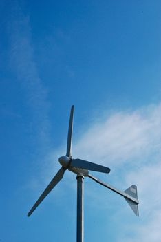 windmill in blue sky day from ground floor