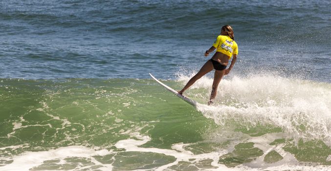 BREAKA BURLEIGH PRO 2013 , GOLD COAST, AUSTRALIA - FEB 3: Unidentified professional female surfer compete on the Burleigh Pro 2013 event, February 3, 2013, Burleigh , Gold Coast, Australia