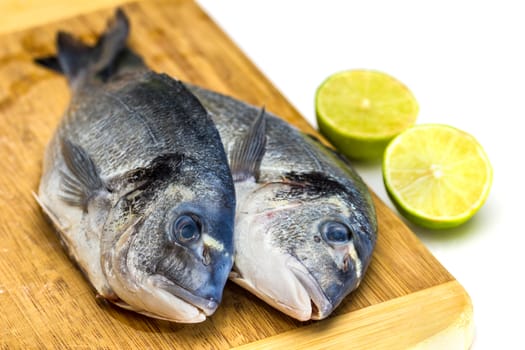 Bream fish with lime isolated on white background