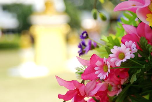 Pink artificia flower on blurred background