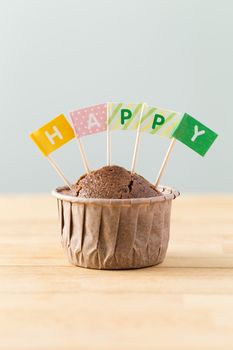 Flag on muffin with a word happy