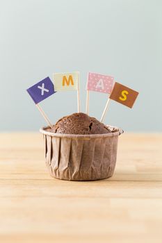 Chocolate muffins with small flag of a x mas
