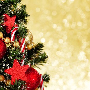 Beautiful decorated christmas tree on golden background