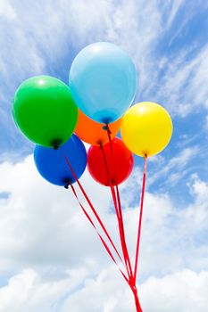 Bunch of colorful balloons in blue sky