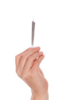Male hand holding cannabis joint isolated on white background. Medical marijuana.