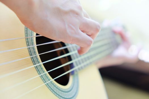 Close up image of Man playing his guitar Background